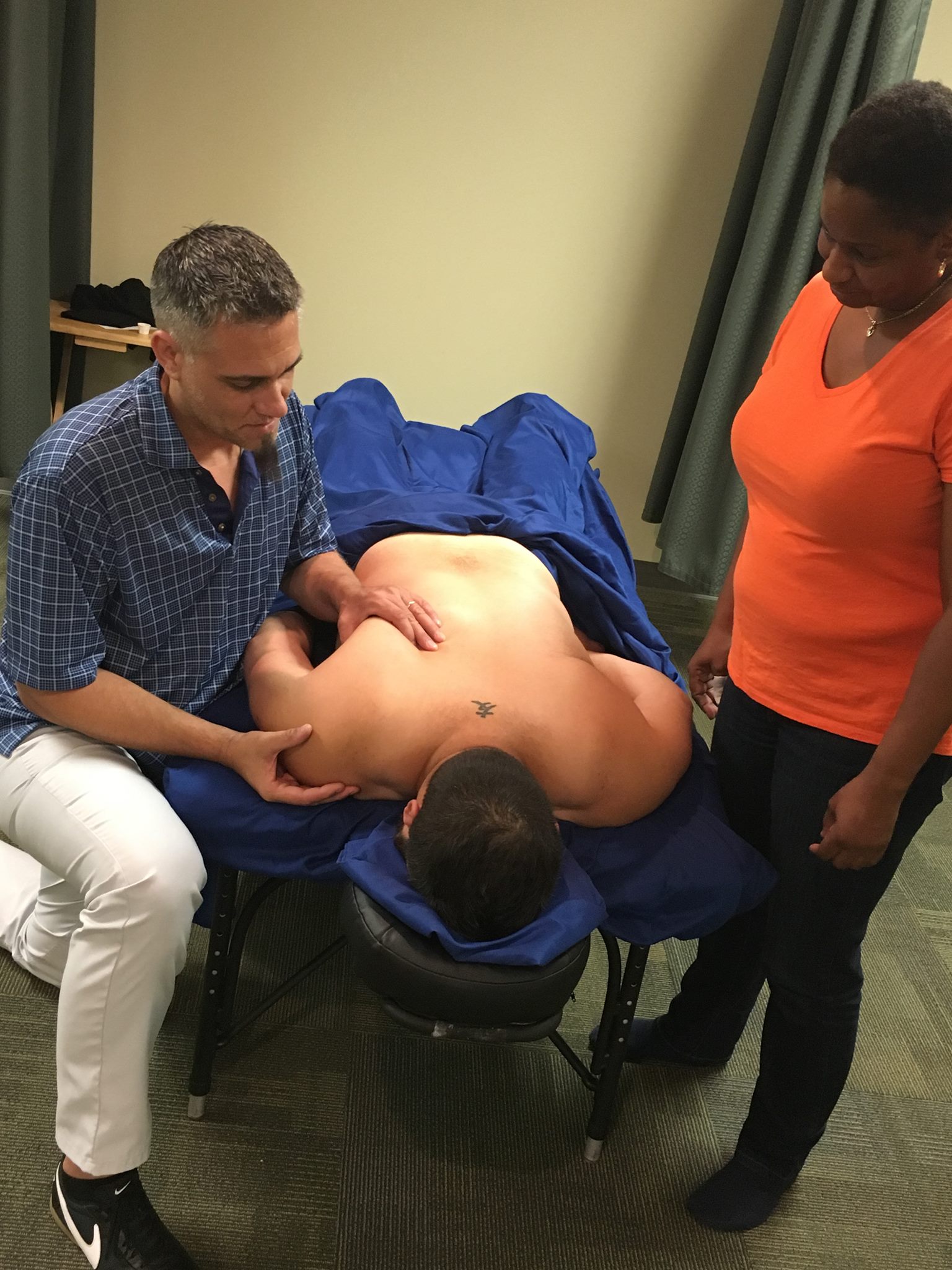 Sean demonstrating shoulder work at our medical massage therapy school - floridasab